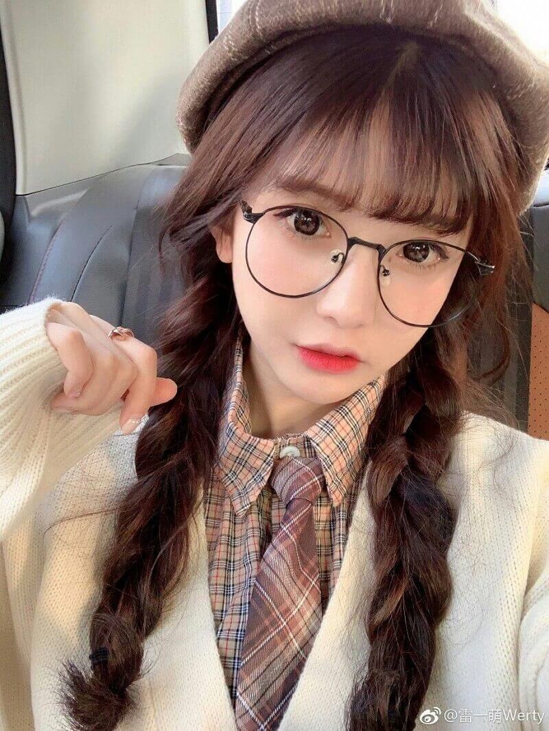 The pure beauty of a beautiful girl with long hair and glasses